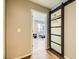 Hallway with sliding barn door leading to bedroom at 3698 Rawhide Ct, Las Vegas, NV 89120