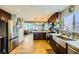 Modern kitchen with farmhouse sink and stainless steel appliances at 3698 Rawhide Ct, Las Vegas, NV 89120