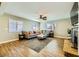 Spacious living room featuring a cozy fireplace and hardwood floors at 3698 Rawhide Ct, Las Vegas, NV 89120