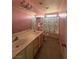 Bathroom with double vanity and a shower/tub combo at 4900 Quinlan Ave, Las Vegas, NV 89130