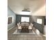 Well-lit dining room with tile floor and a table with seating for six at 4900 Quinlan Ave, Las Vegas, NV 89130