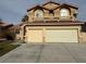 Two-story home features a three-car garage and a balcony at 4900 Quinlan Ave, Las Vegas, NV 89130