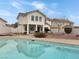 Backyard view of this beautiful house showing grass area, landscaping and swimming pool at 504 Landra Ln, Henderson, NV 89015