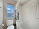 Bright bathroom featuring a tub/shower combo with white tile and decorative shower curtain at 504 Landra Ln, Henderson, NV 89015