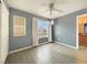 Bedroom with a ceiling fan, natural light, and a view of the backyard at 504 Landra Ln, Henderson, NV 89015