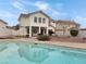 Home exterior with pool reflecting building details at 504 Landra Ln, Henderson, NV 89015