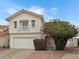 Two story house with attached garage and landscaping at 504 Landra Ln, Henderson, NV 89015