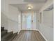 Inviting foyer with modern flooring and staircase, transom window door at 504 Landra Ln, Henderson, NV 89015