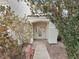 Charming front entry with decorative door and stucco facade at 504 Landra Ln, Henderson, NV 89015