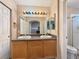 Double sink vanity in the main bathroom with an archway and a view of the walk-in shower at 504 Landra Ln, Henderson, NV 89015