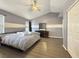 Vaulted ceiling main bedroom with a ceiling fan and view of closet and dresser at 504 Landra Ln, Henderson, NV 89015