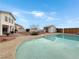 Backyard swimming pool reflecting home and landscaped surroundings at 504 Landra Ln, Henderson, NV 89015