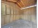 Unfinished interior of a spacious storage shed at 504 Landra Ln, Henderson, NV 89015