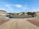 Neighborhood street view showing well-maintained homes and community landscaping under a bright blue sky at 504 Landra Ln, Henderson, NV 89015