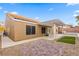 A private backyard features a covered patio and well-manicured landscaping, perfect for outdoor entertaining at 1053 Plentywood Pl, Henderson, NV 89002