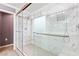 This primary bathroom features a glass shower, decorative tile, and modern fixtures at 1053 Plentywood Pl, Henderson, NV 89002