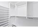 The closet is all white with shelving, bars for hanging clothes, and base molding at 1053 Plentywood Pl, Henderson, NV 89002