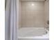 Clean and modern bathroom with a white shower curtain and elegant tile at 322 Karen Ave # 3707, Las Vegas, NV 89109