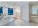 Bright bathroom boasts double sinks, a soaking tub with city views, and a glass shower at 322 Karen Ave # 3707, Las Vegas, NV 89109
