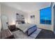 Modern bedroom with a plush queen bed, stylish decor, and a large window showcasing city views at 322 Karen Ave # 3707, Las Vegas, NV 89109