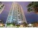 Modern high-rise building featuring balconies and well-manicured landscaping at 322 Karen Ave # 3707, Las Vegas, NV 89109