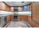 Bright kitchen with stainless steel appliances, granite countertops, and custom wood cabinetry at 322 Karen Ave # 3707, Las Vegas, NV 89109