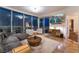 Modern living room with a city view, comfortable seating, and a flat-screen TV at 322 Karen Ave # 3707, Las Vegas, NV 89109