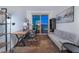 Home office with a desk, shelving, and sofa, providing a comfortable and functional workspace at 322 Karen Ave # 3707, Las Vegas, NV 89109
