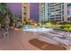 Inviting pool deck with lounge chairs and a waterfall feature, set against a backdrop of high-rise buildings at 322 Karen Ave # 3707, Las Vegas, NV 89109