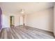 Well lit bedroom with hardwood floors and access to bathroom at 7745 Tyrell Peaks St, Las Vegas, NV 89139