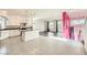 Modern kitchen with white cabinets, granite island and hardwood floors at 7745 Tyrell Peaks St, Las Vegas, NV 89139