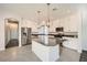 Modern kitchen with white cabinets and granite countertops at 7745 Tyrell Peaks St, Las Vegas, NV 89139