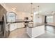 Bright kitchen with granite countertops, stainless steel appliances, and white cabinets at 7745 Tyrell Peaks St, Las Vegas, NV 89139