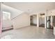Modern kitchen with white cabinets, granite island and hardwood floors at 7745 Tyrell Peaks St, Las Vegas, NV 89139