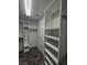 Spacious walk-in closet with shelving and hanging rods at 7745 Tyrell Peaks St, Las Vegas, NV 89139