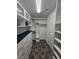 Spacious walk-in closet with built-in shelving and drawers at 7745 Tyrell Peaks St, Las Vegas, NV 89139
