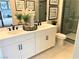 Modern bathroom with double vanity and walk-in shower at 114 Antler Square Ln, Henderson, NV 89011