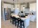 Modern kitchen with white cabinets, stainless steel appliances, and an island at 114 Antler Square Ln, Henderson, NV 89011