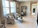 Bright loft sitting area features two armchairs, a coffee table, and a built-in desk at 114 Antler Square Ln, Henderson, NV 89011