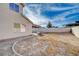 Large backyard with gravel landscaping and house at 1565 Pasture Ln, Las Vegas, NV 89110