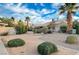 Landscaped backyard with a path and guest parking at 1565 Pasture Ln, Las Vegas, NV 89110