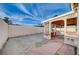 Large backyard with a covered patio and block wall at 1565 Pasture Ln, Las Vegas, NV 89110