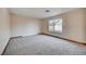 Bright bedroom with carpeted floor and large window at 1565 Pasture Ln, Las Vegas, NV 89110