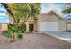 One-story house with a white garage door and small front yard at 1565 Pasture Ln, Las Vegas, NV 89110