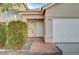 Front entry with white door and terracotta tile flooring at 1565 Pasture Ln, Las Vegas, NV 89110