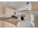 Kitchen features granite countertops and black appliances at 1565 Pasture Ln, Las Vegas, NV 89110