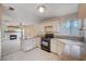 Kitchen with granite countertops, black appliances, and island at 1565 Pasture Ln, Las Vegas, NV 89110