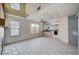 Kitchen and living area with tile floor and island at 1565 Pasture Ln, Las Vegas, NV 89110