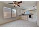 Kitchen with island and white cabinets at 1565 Pasture Ln, Las Vegas, NV 89110