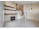 High ceiling living room with fireplace and tile floors at 1565 Pasture Ln, Las Vegas, NV 89110